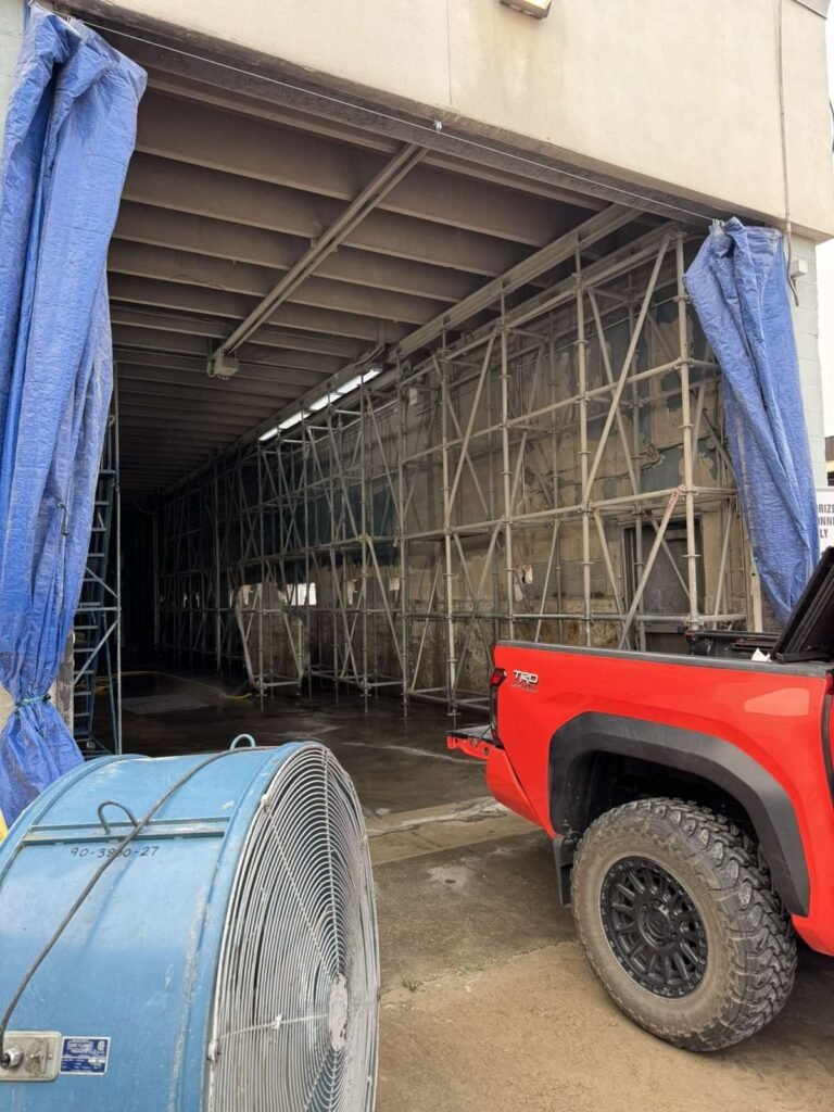 Scaffold stands inside an open bay before shrink wrap.